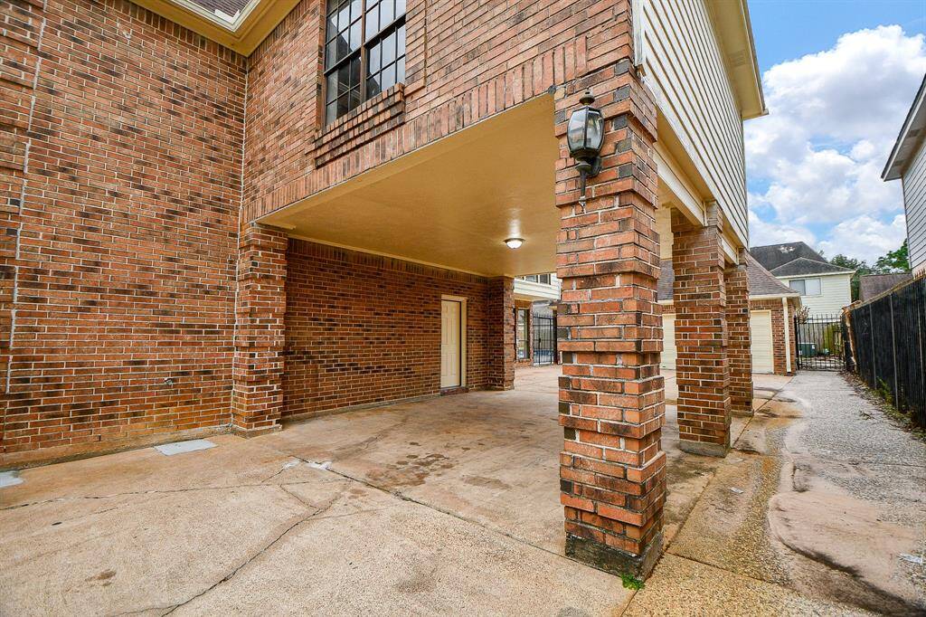 This inviting backyard features a sparkling pool and a relaxing hot tub, perfect for summer fun and entertaining.