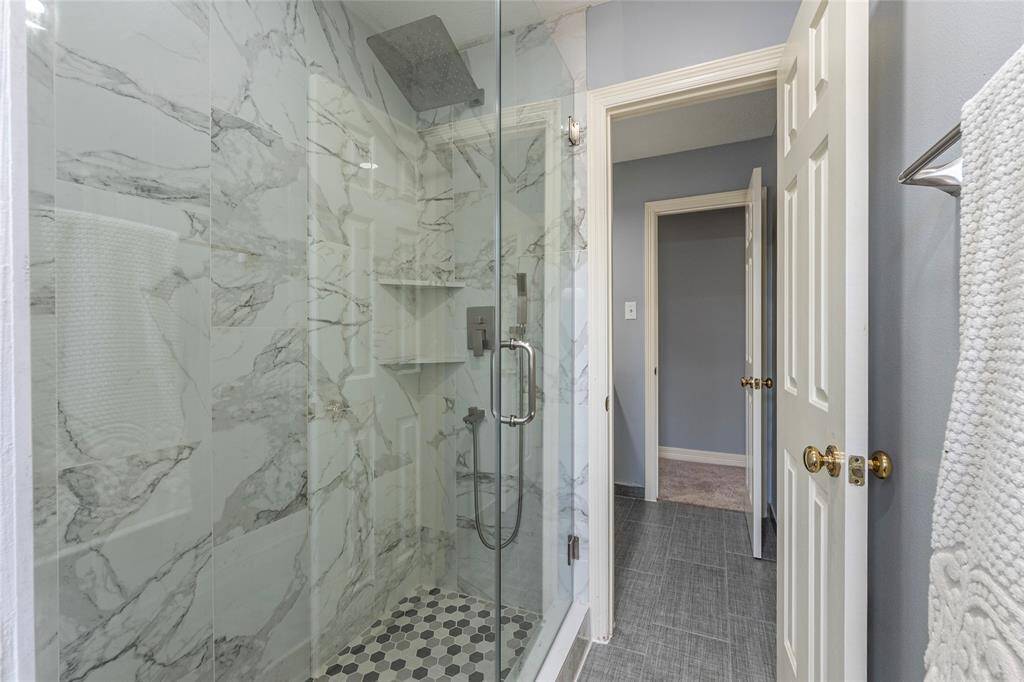 A closer look at the beautifully updated seamless glass walk-in shower in the 3rd bathroom upstairs.