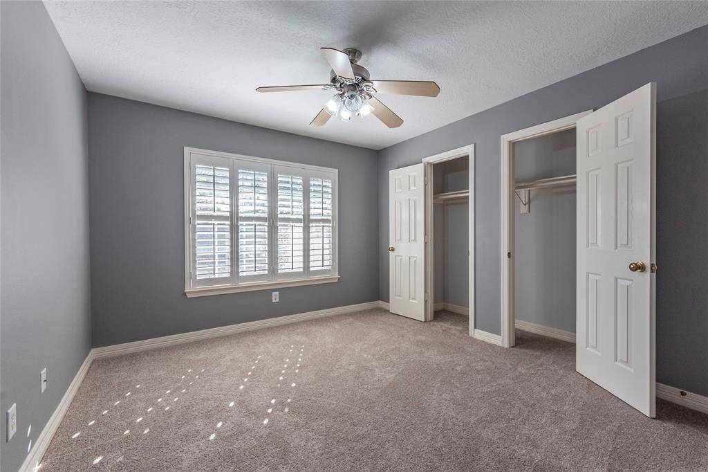 5th Bedroom with NEW carpet is very spacious with double door closet space and Plantation shutters.