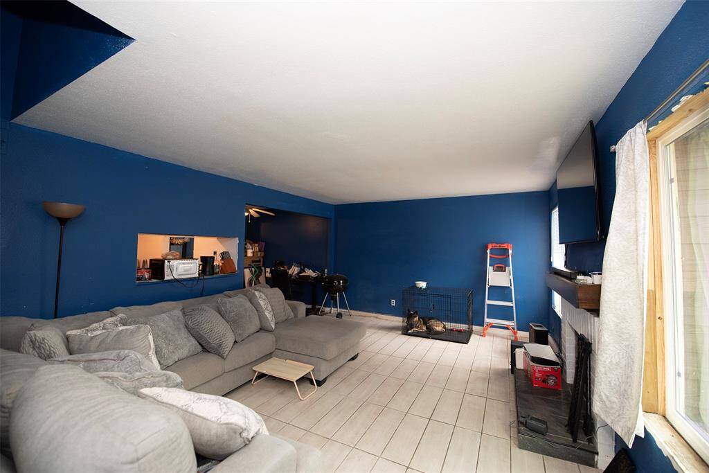 Entry to the home showing the large living space. Will easily fit your large sectional sofa.