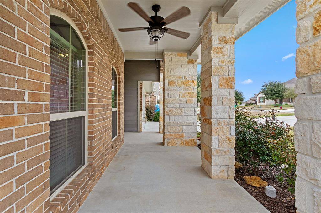 Can you see yourself sitting on this quaint front porch?