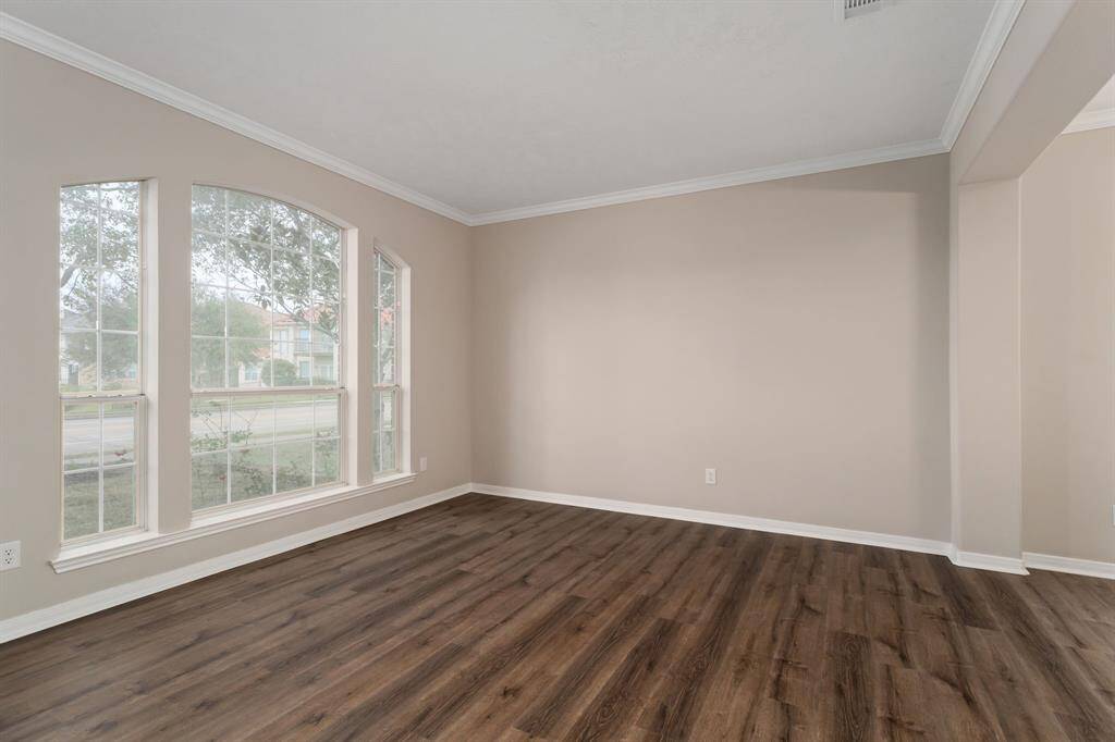 Formal living room! The interior of the home has NEW FLOORING AND PAINT THROUGHOUT!
