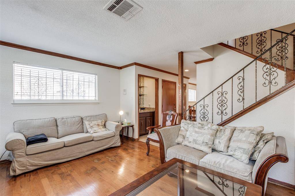 Windows that flood the living room with natural light, creating a bright and cheerful space.