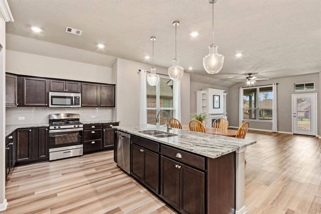 As you can see the kitchen over looks the living, so you are always a part of the action.