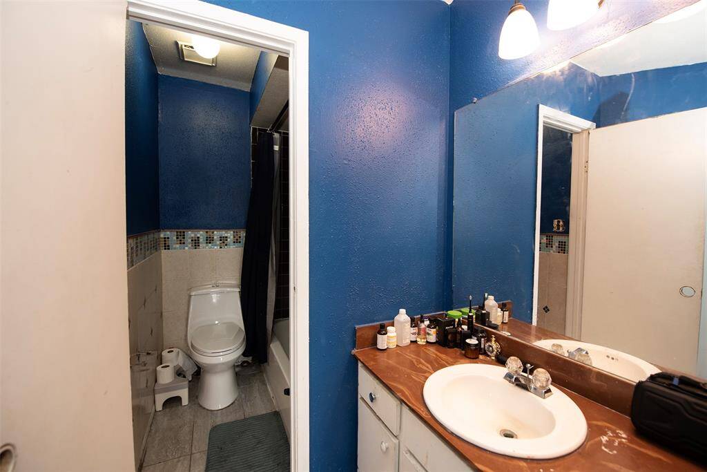 Primary bedroom includes bath with vanity separate from the bathing area.