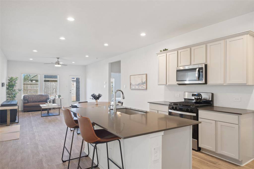 Step into this stunning modern kitchen, where sleek design meets ultimate functionality.