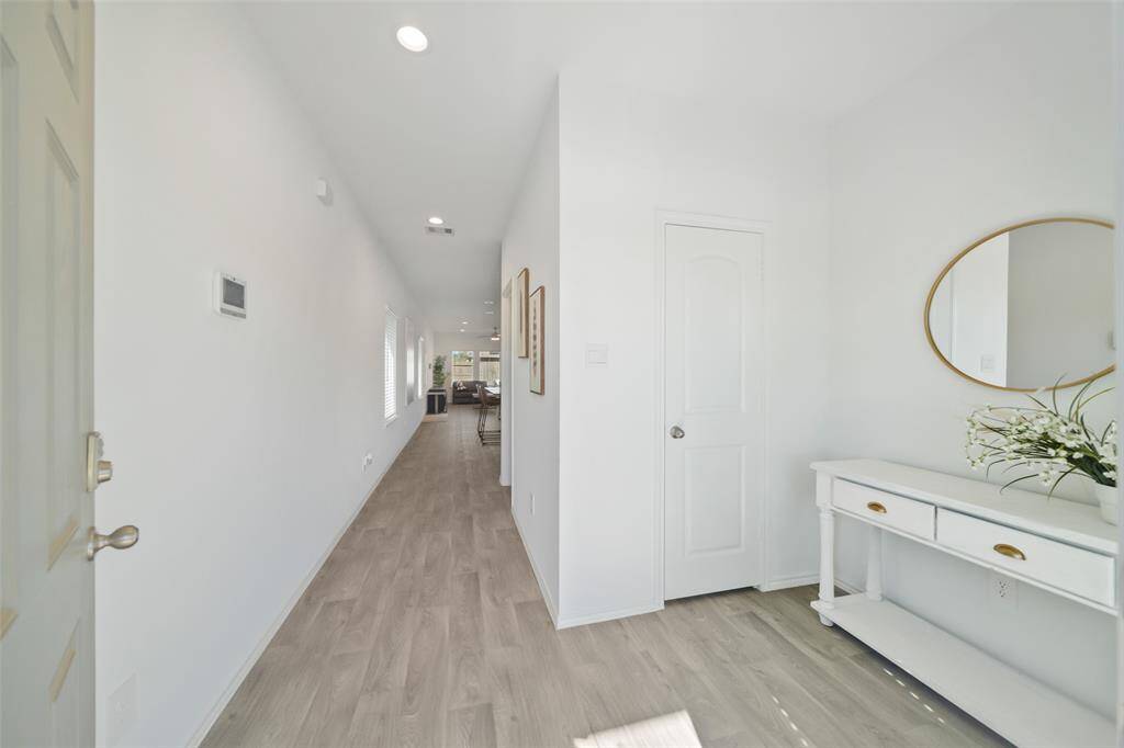 The front hallway offers a welcoming and modern first impression with a sleek feel.