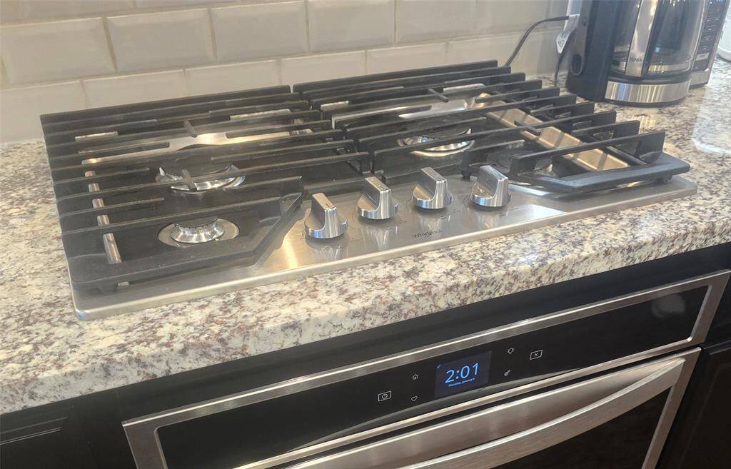 The kitchen offers a gas range top