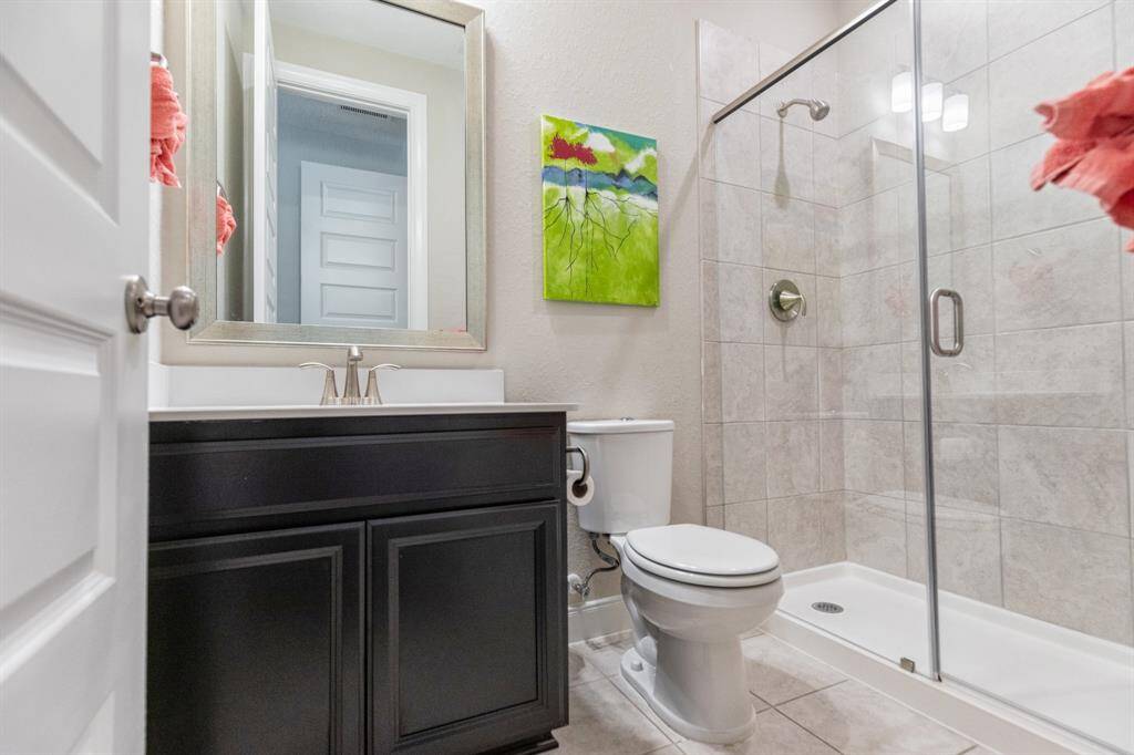 The second full bath, just outside the 2nd bedroom offers a walk in shower.