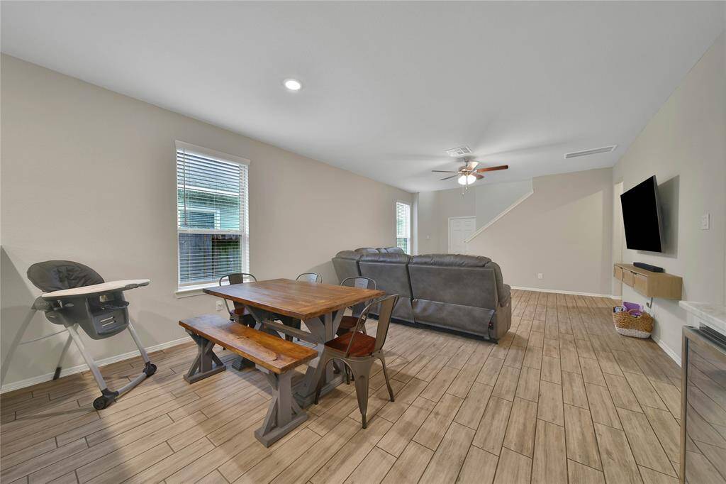 This charming dining space sits right between the kitchen and living room, making mealtime and entertaining a breeze.
