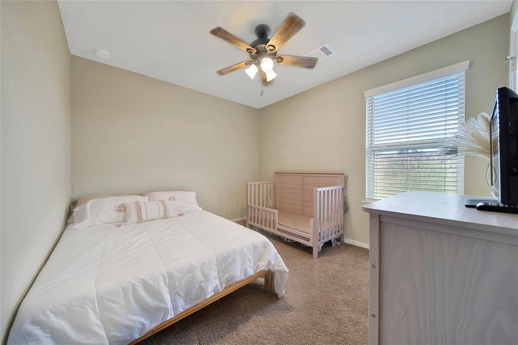 The third secondary bedroom offers versatility—great for a guest room, playroom, or hobby space.