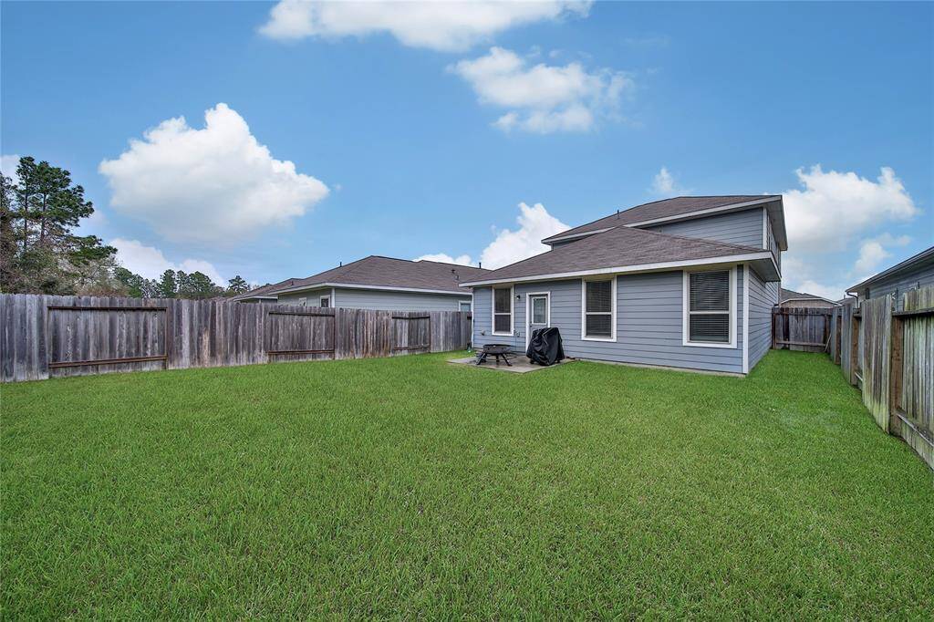 Your outdoor retreat awaits! A fenced-in backyard and charming patio offer the perfect space for lounging or entertaining.