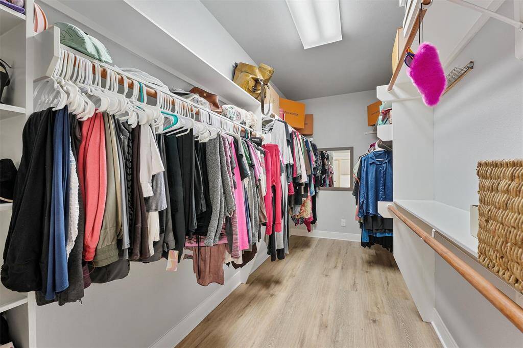 Master closet is very large with storage shelves and cabinets