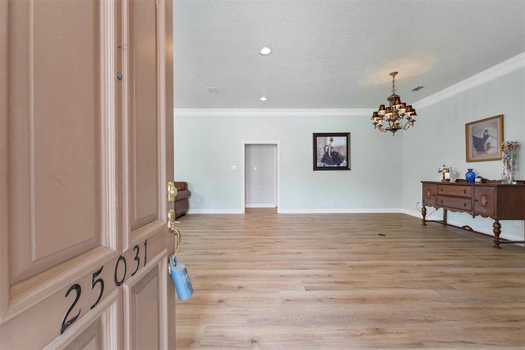 Entrance to home with formal dining or study area.