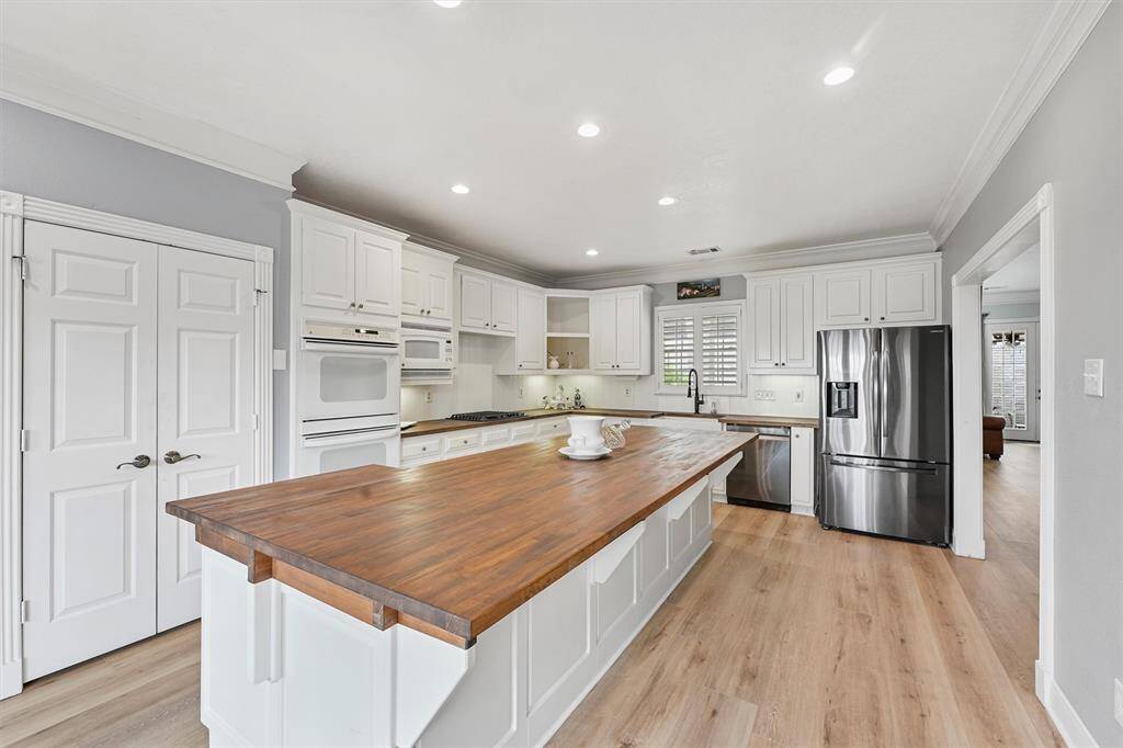 Another view of updated kitchen with new dishwasher and stovetop