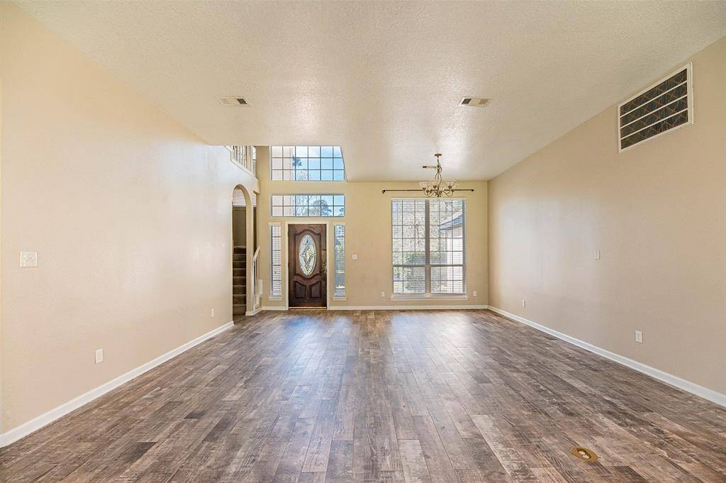 This spacious living and dining area allows for thoughtful design to make multiple uses of the room.