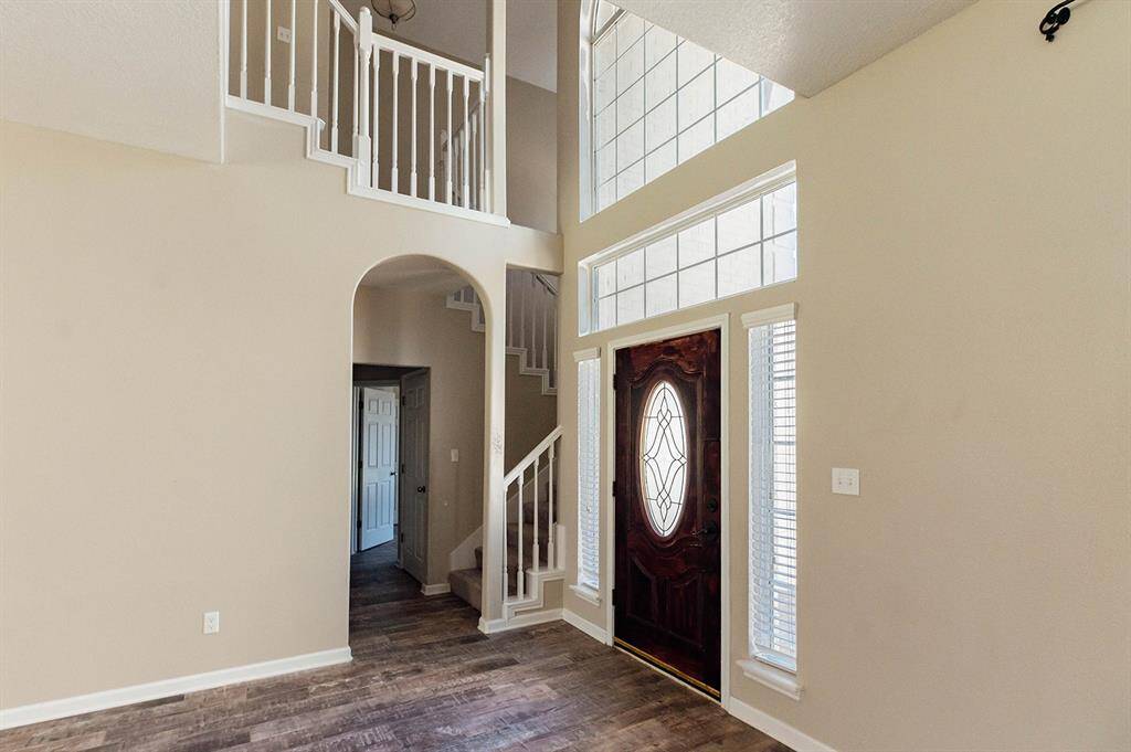 Enjoy the touches of style with arched hallways and charming handrailing.