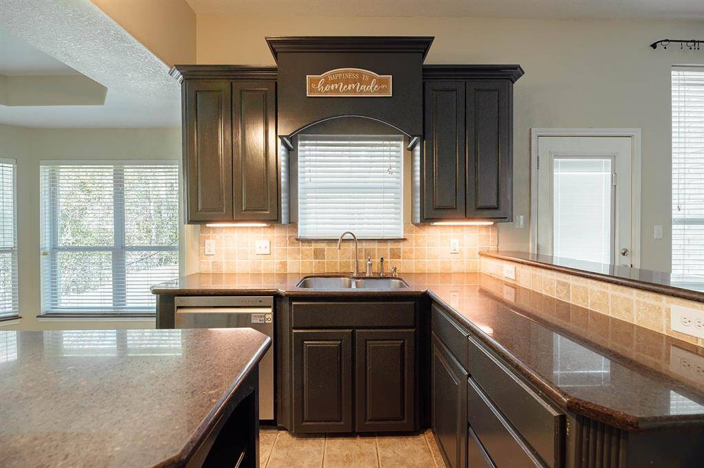 Ample cabinet space and vast countertops make this kitchen a dream.