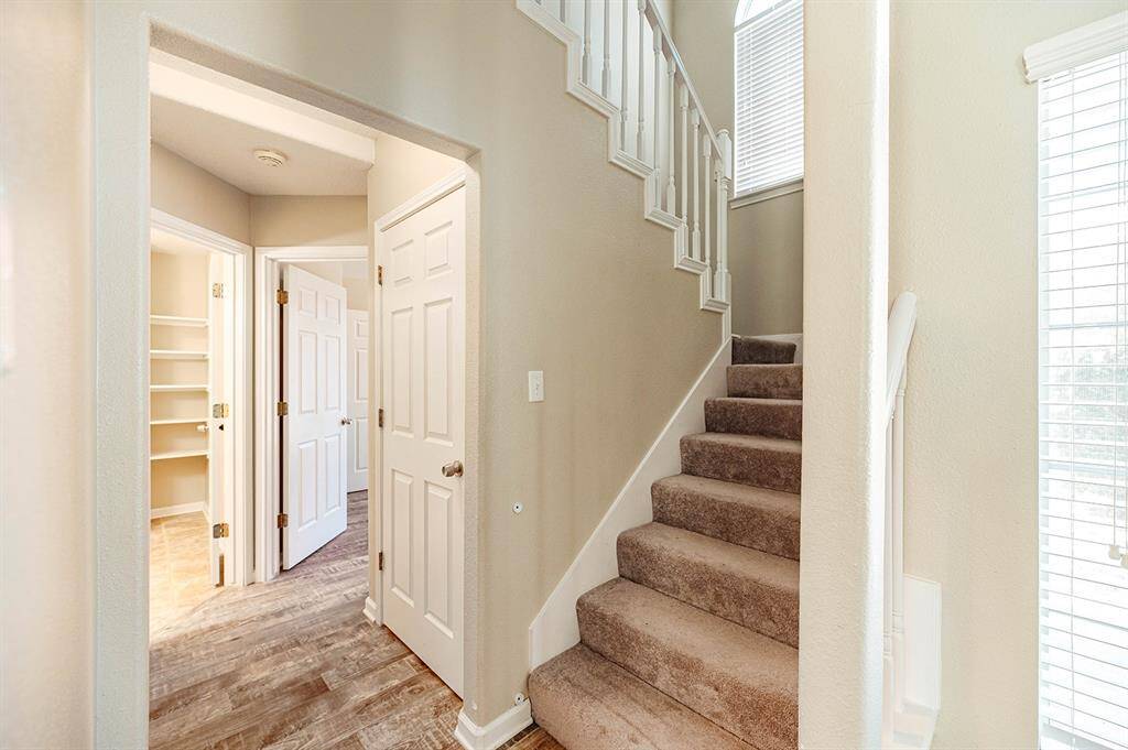 Under-the stair storage closet making use of every inch of the home for top functionality.
