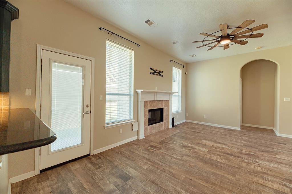 Enjoy ease of access with the back door leading out to the expansive backyard.
