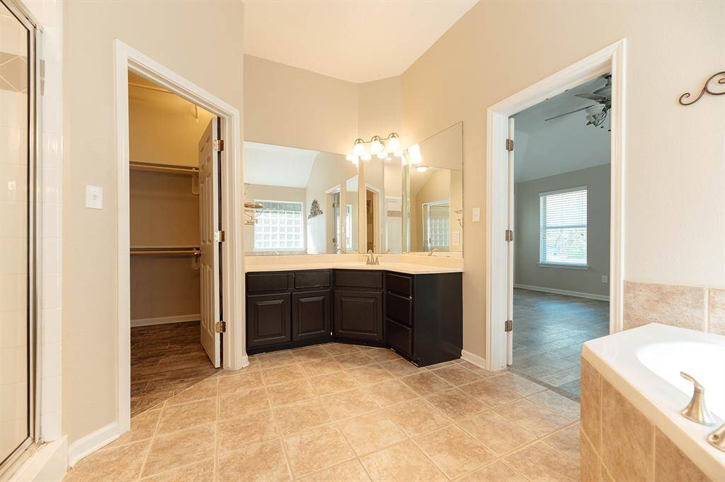 Elegant and functional primary bathroom designed to provide comfort and convenience.