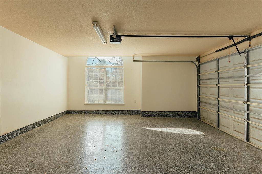Convenient 4-car garage space with room for vehicles, tools, and extra storage needs.