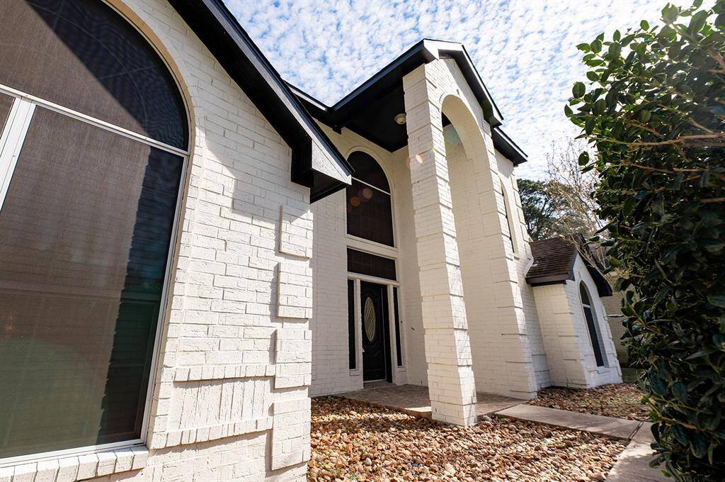 The unique brick pattern and white finish brightens the home and adds to the eye-catching curb appeal.