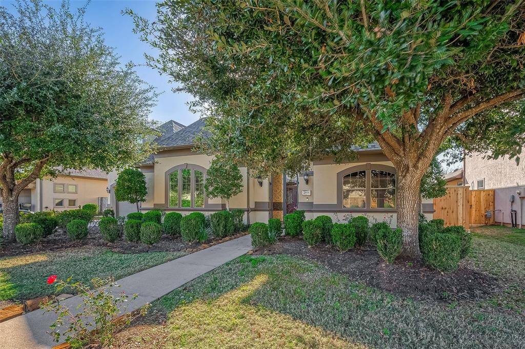 Charming single-story home with a well-maintained front yard and mature trees. Features a welcoming pathway leading to a covered entrance, complemented by large windows and attractive landscaping. Perfect for a cozy and inviting residence.