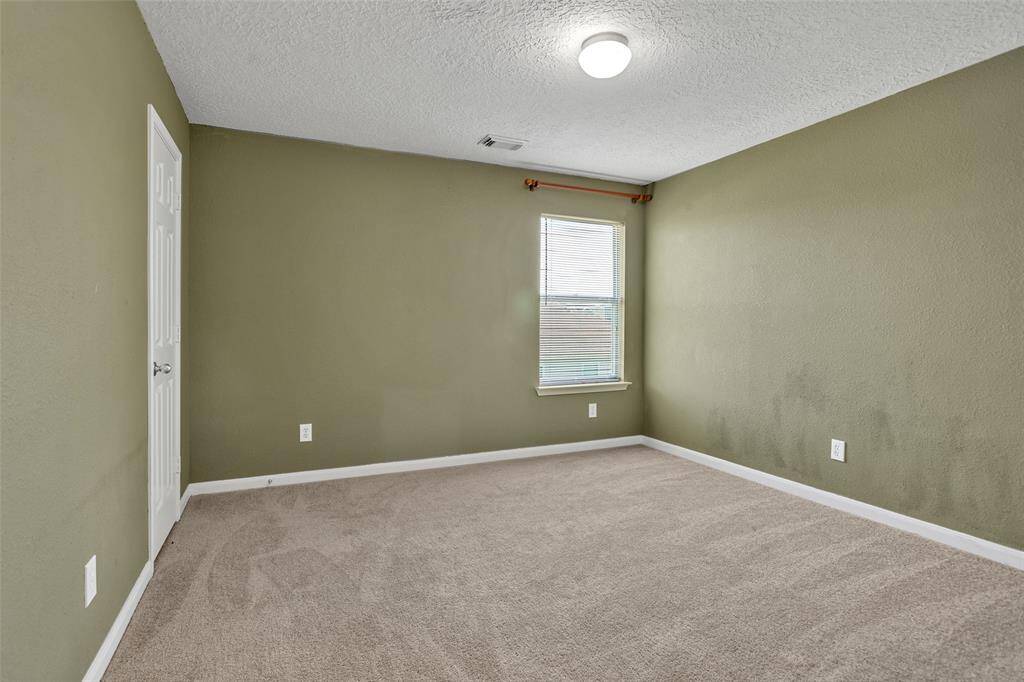 Secondary bedrooms are spacious with generous closet space.