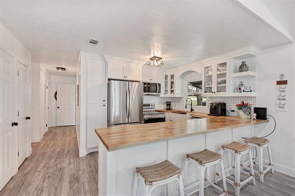 A light and bright space designed for all your cooking and entertaining needs, featuring a fully remodeled kitchen with brand-new appliances!