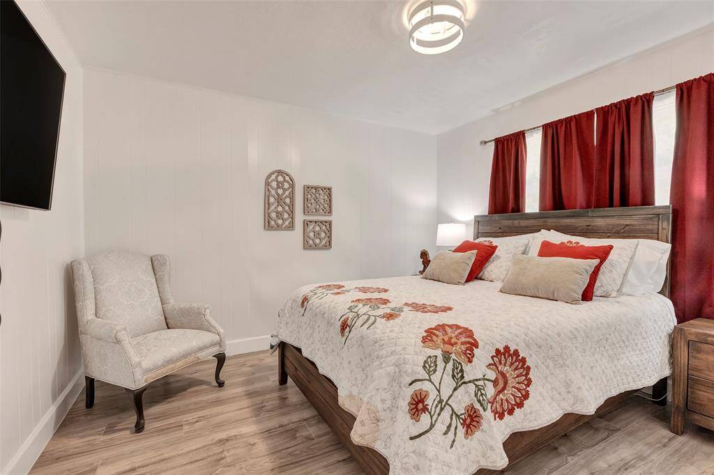 Charming secondary bedroom featuring a private en-suite half bath.