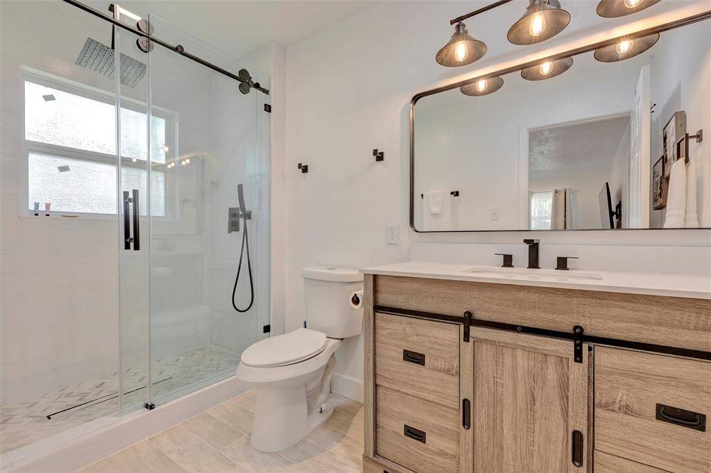 Stylish full bathroom with large walk-in shower