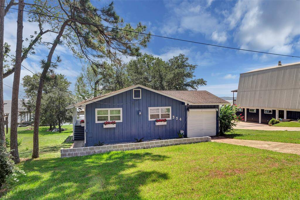 This delightful blue bungalow offers everything you need and so much more!