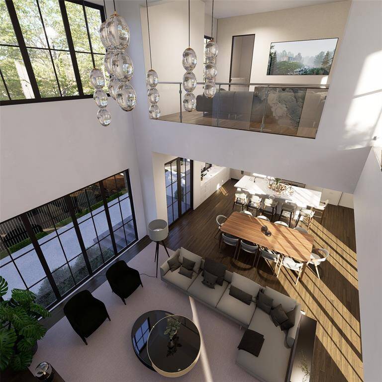 The space is expansive and thoughtfully laid out, with minimal walls, allowing natural flow between the living room, dining area, and kitchen