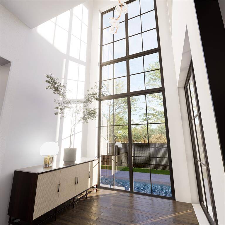 Featuring a sleek, modern design with expansive glass windows and a contemporary facade