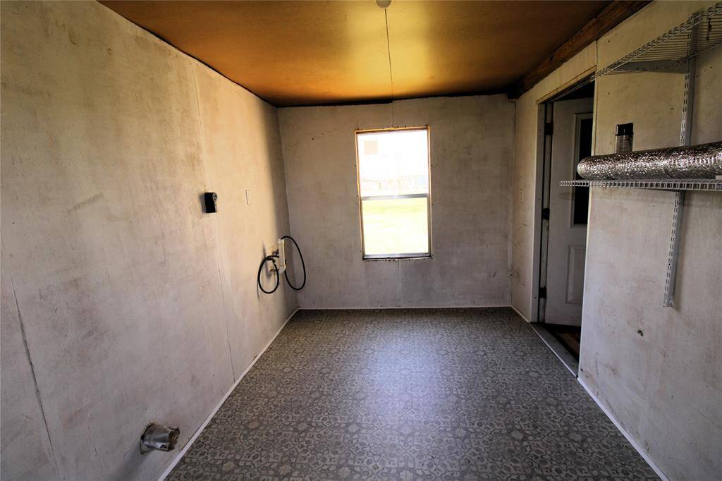 Closed in back porch, located off the kitchen.