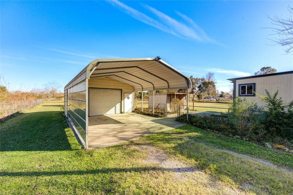 Covered Carport and detached garage.