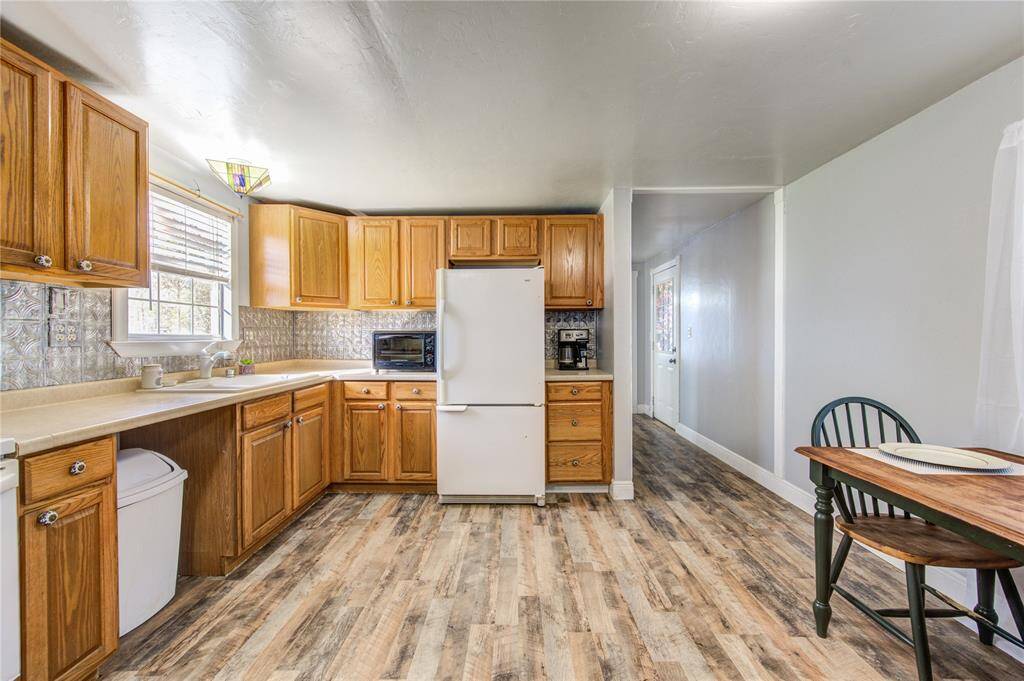 Kitchen area leading to second bedroom. Split floor plan!