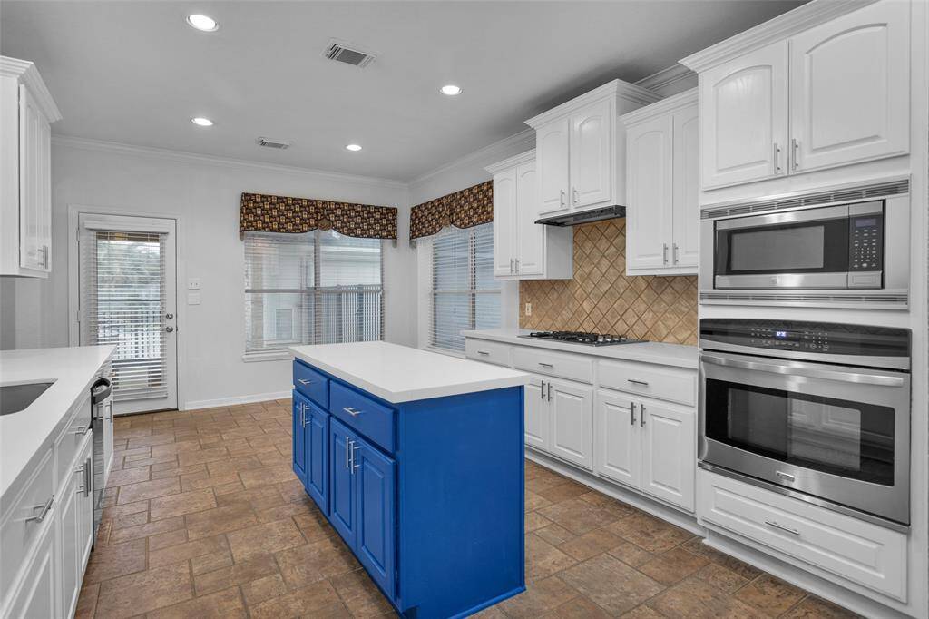 Add a breakfast table to enjoy taking in the view of the pool and large windows provide natural light.
