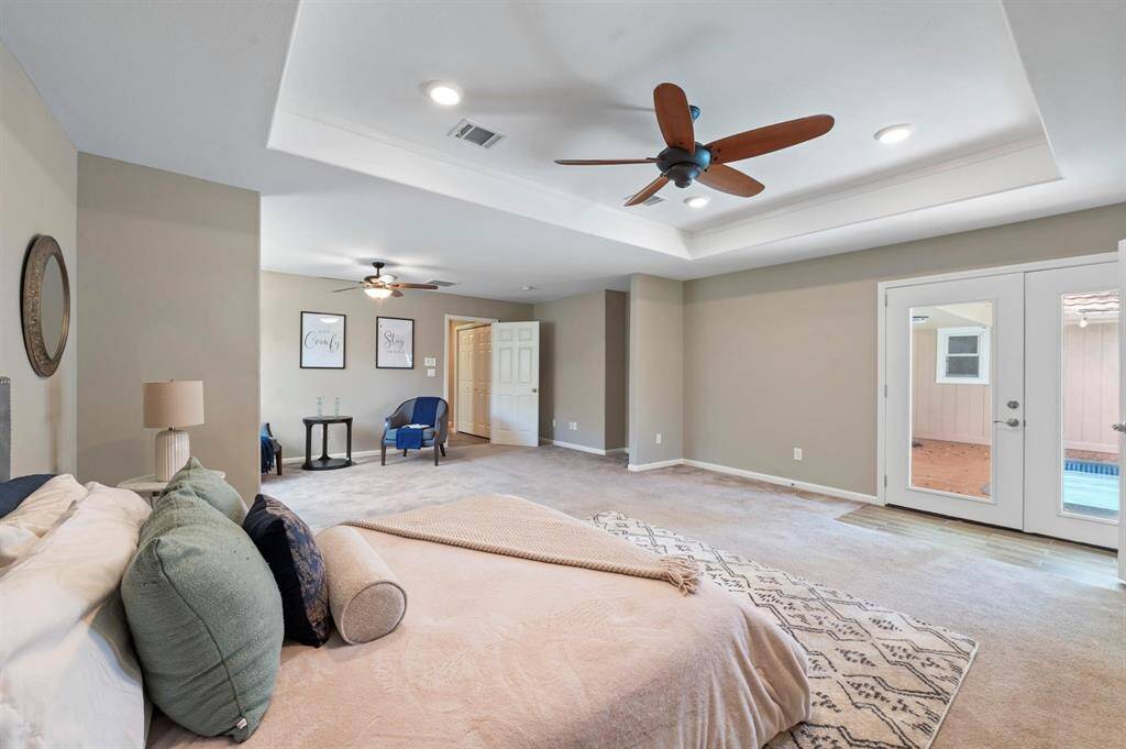 From your primary suite, you have access to your backyard and private pool!