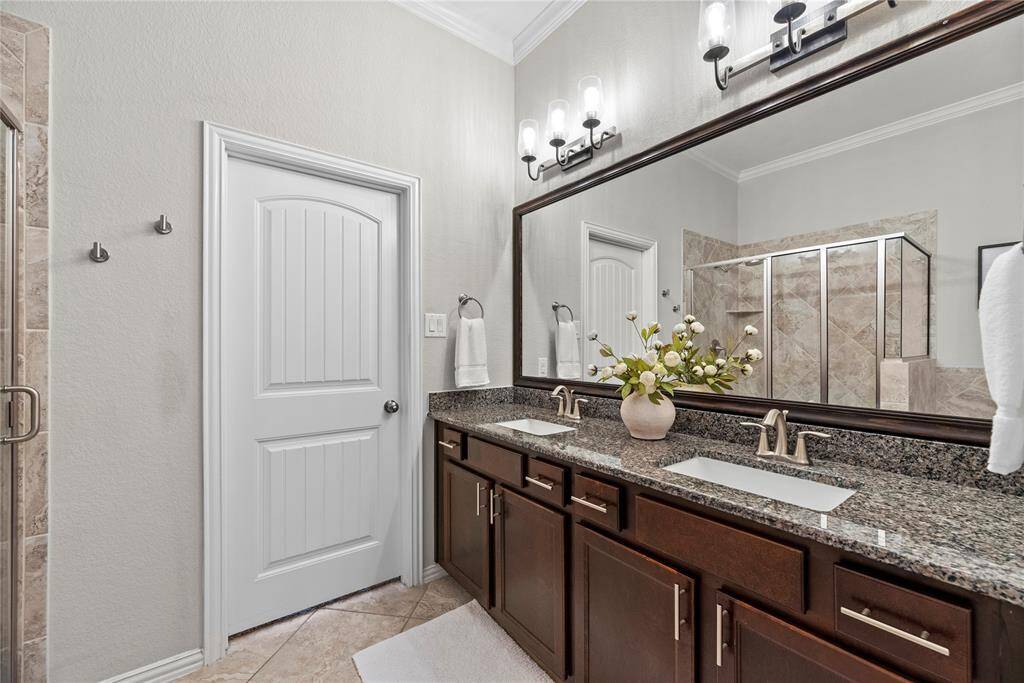 Primary Bathroom with double sinks and granite counter tops.