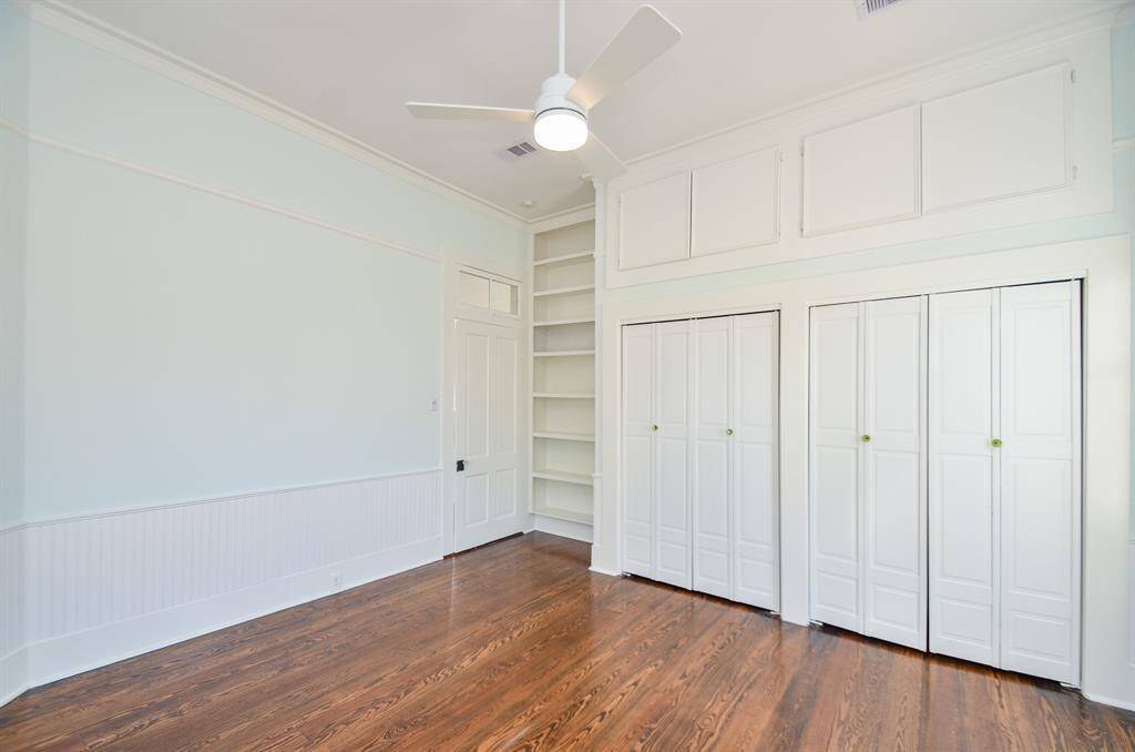 Primary bedroom has additional storage cabinets above the closet & custom built in closet organizers.