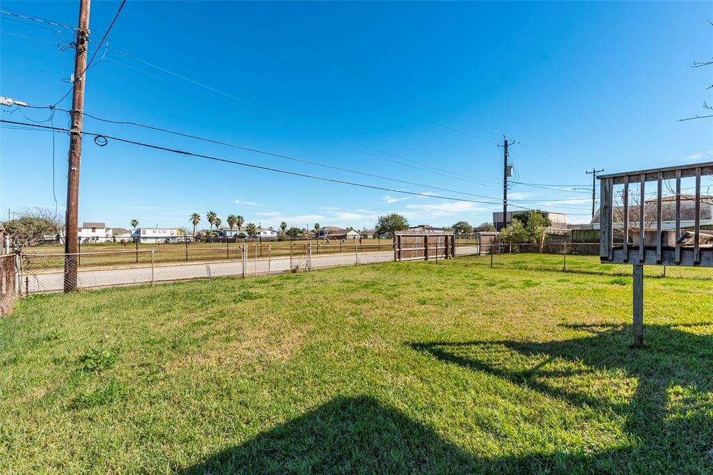 Spacious backyard with direct street access, offering convenience and potential for customization.