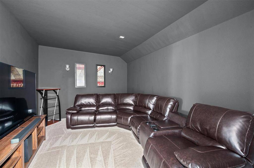 Enjoy private movie nights in this media room.