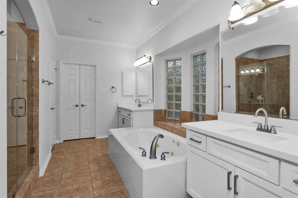 Separate sinks and good size jetted soaking tub and a separate shower.