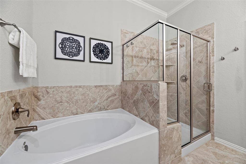 Separate soaking tub and shower.