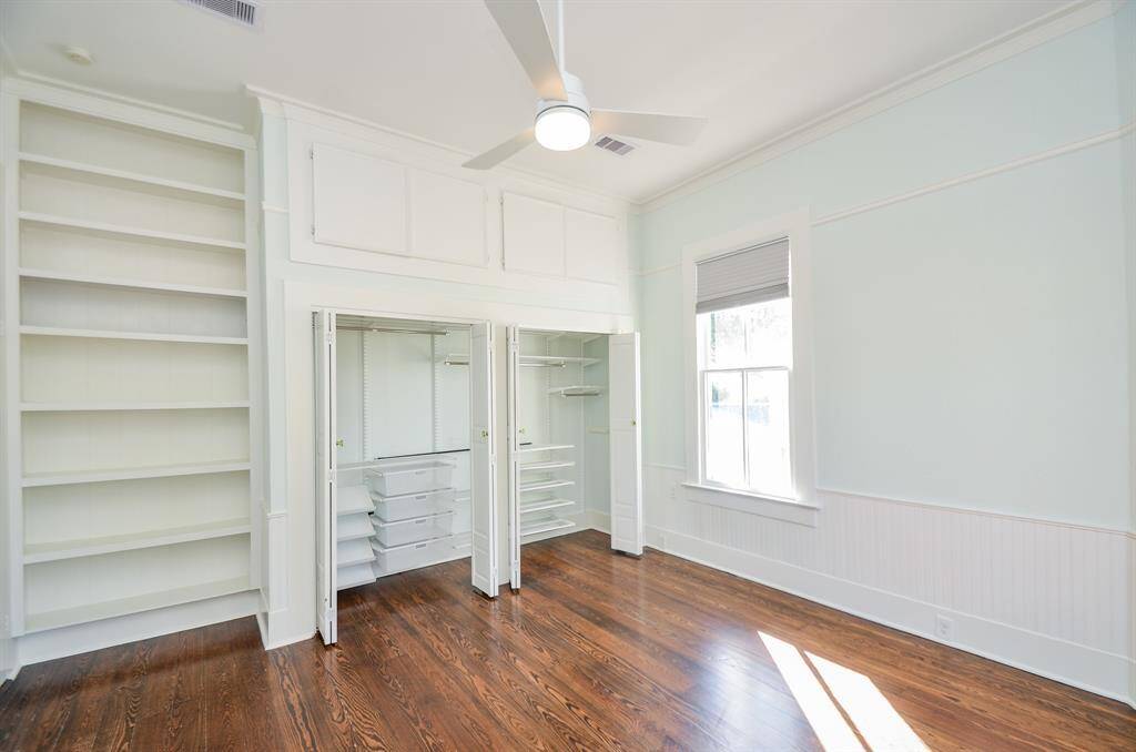 Primary bedroom has additional storage cabinets above the closet & custom built in closet organizers.