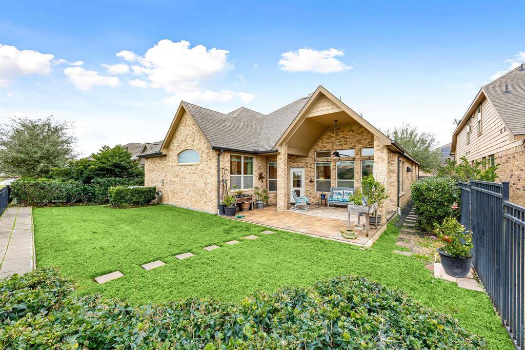 Come and see this spacious backyard with its beautiful covered patio and paved walkway down the side yard. There is plenty of room for the kids to play and adults to relax! Perfect for your outdoor living space, patio furniture, bbq pit, and so much more. The possibilities are endless!