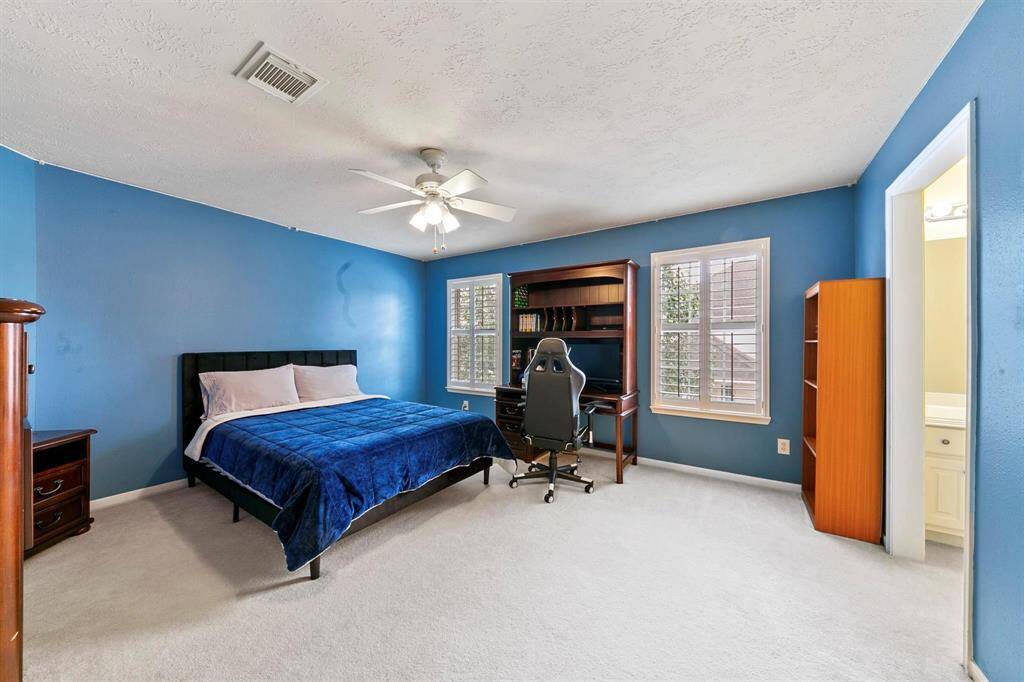 Two of the four secondary bedrooms upstairs are connected by a Jack and Jill bathroom, providing easy access and shared convenience.