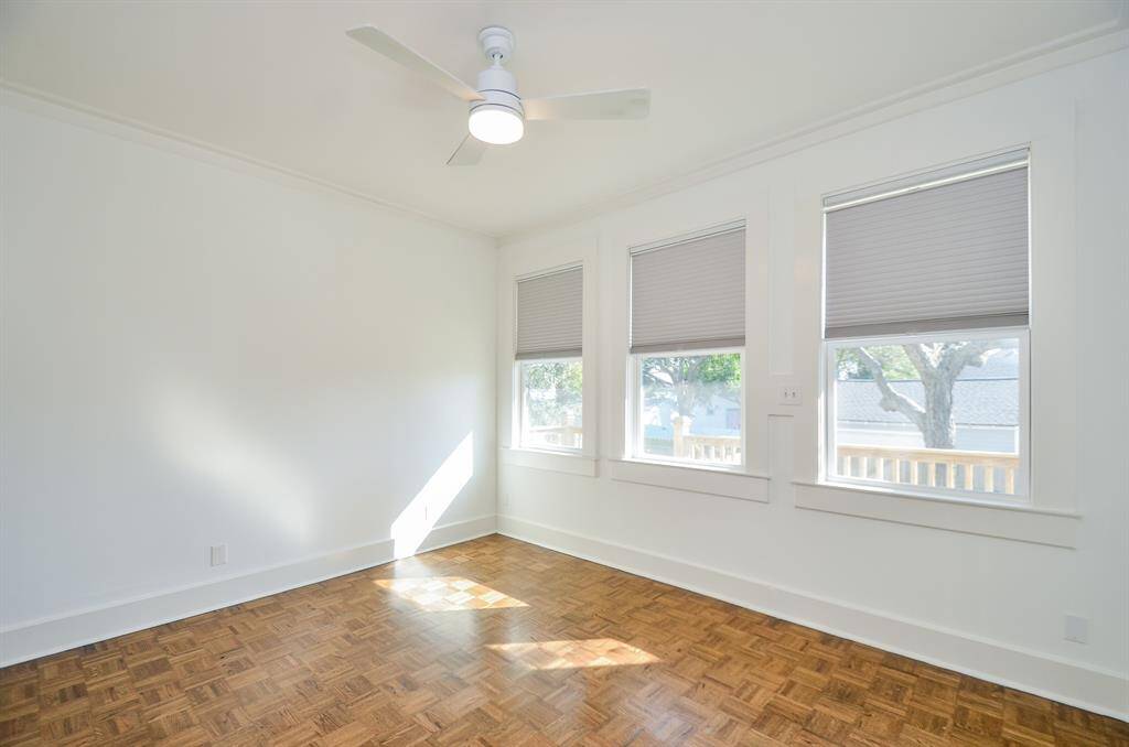 Secondary bedroom with updated energy efficient shades (2022) & beautiful views of the back yard.